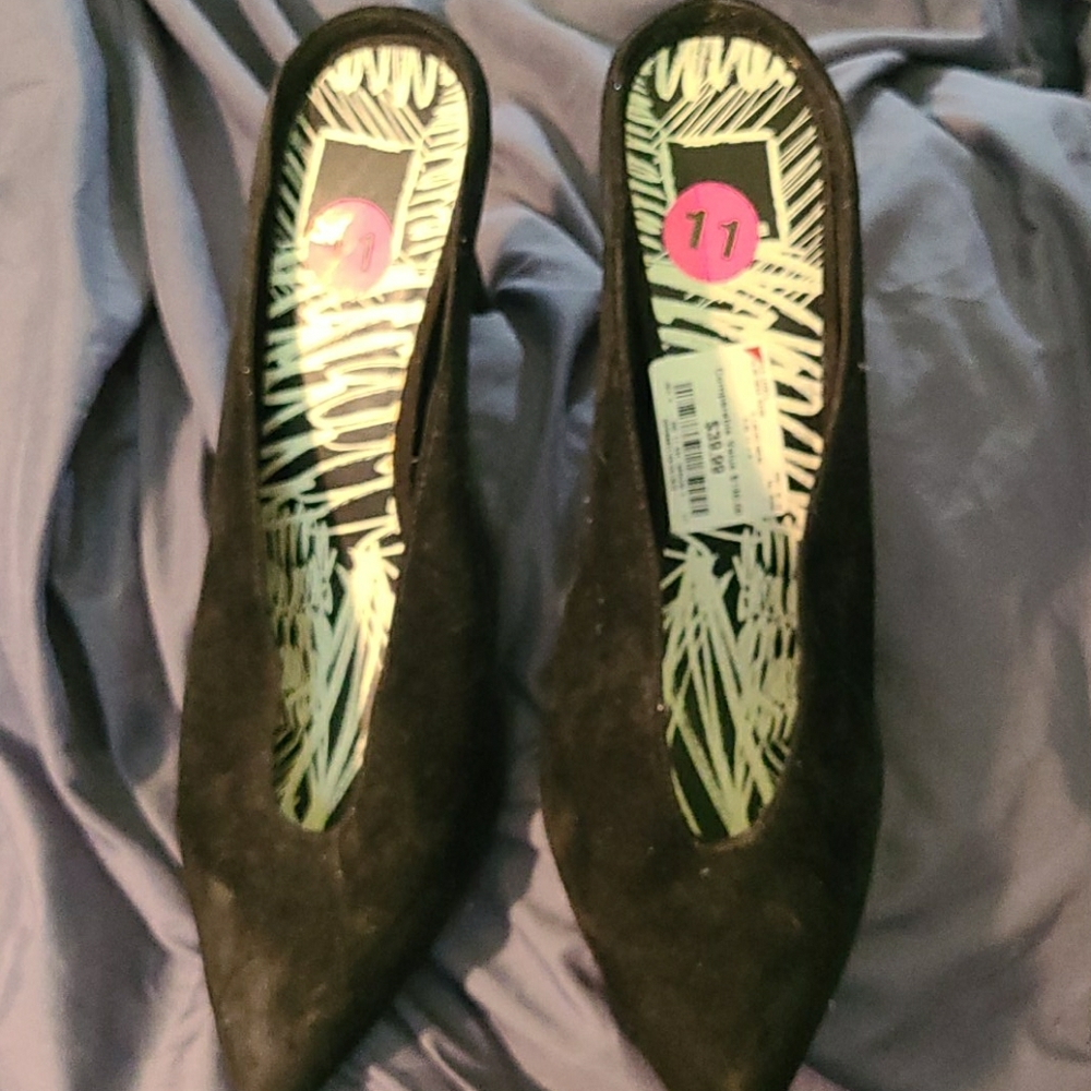 Black suade mules.